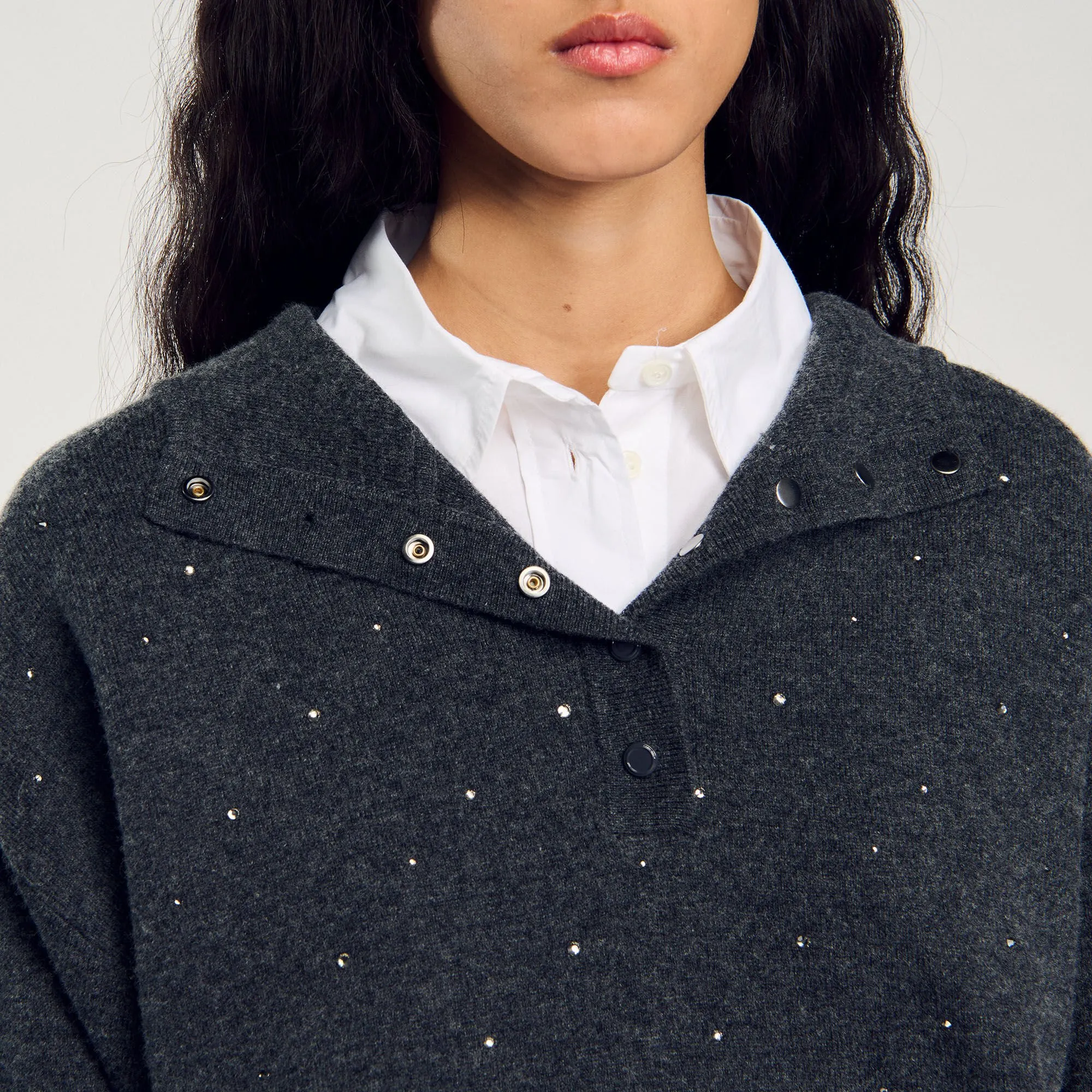 Maglione con cappuccio glitterato