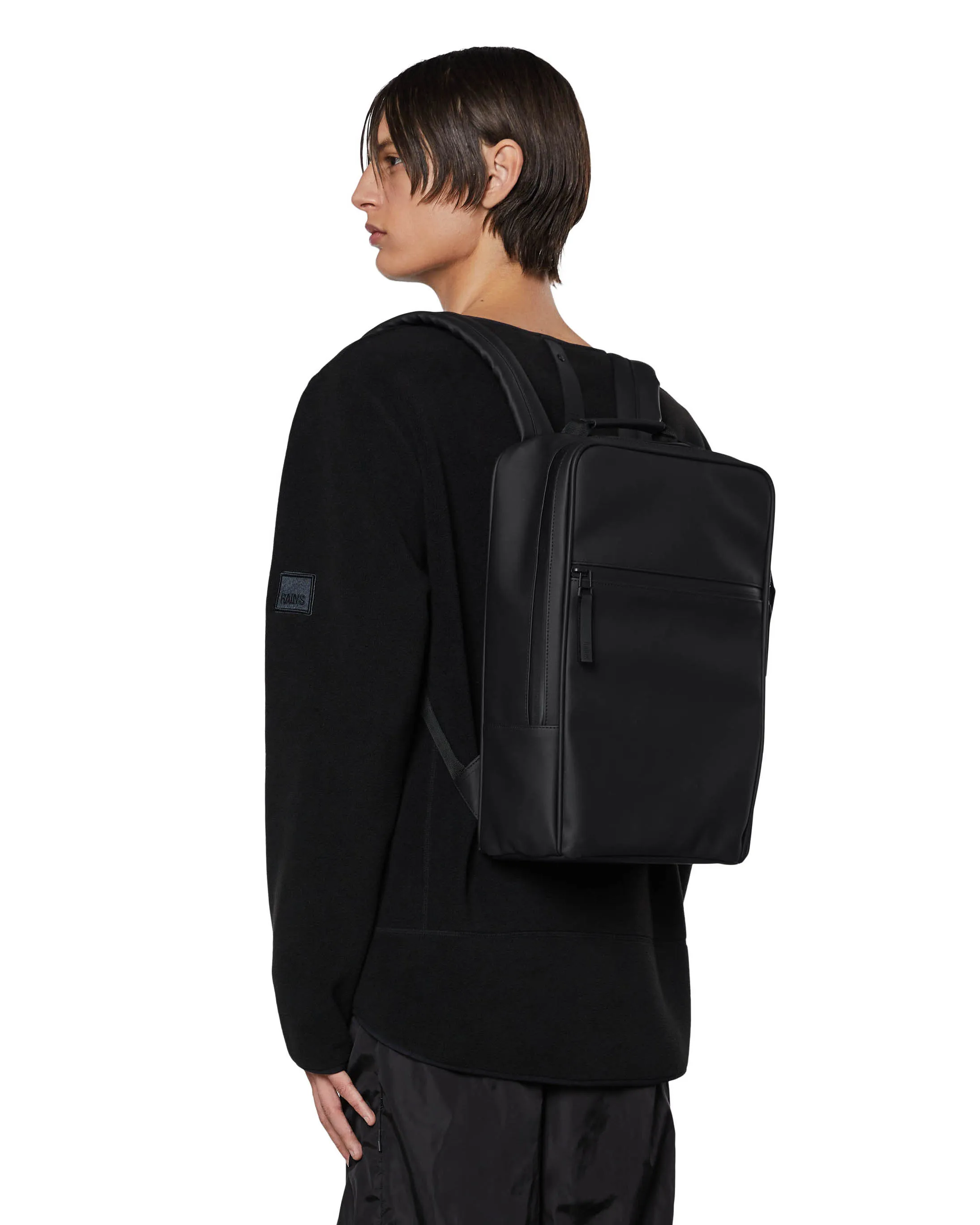 Zaino Book Backpack nero in tessuto tecnico impermeabile effetto gommato con tasca a parete